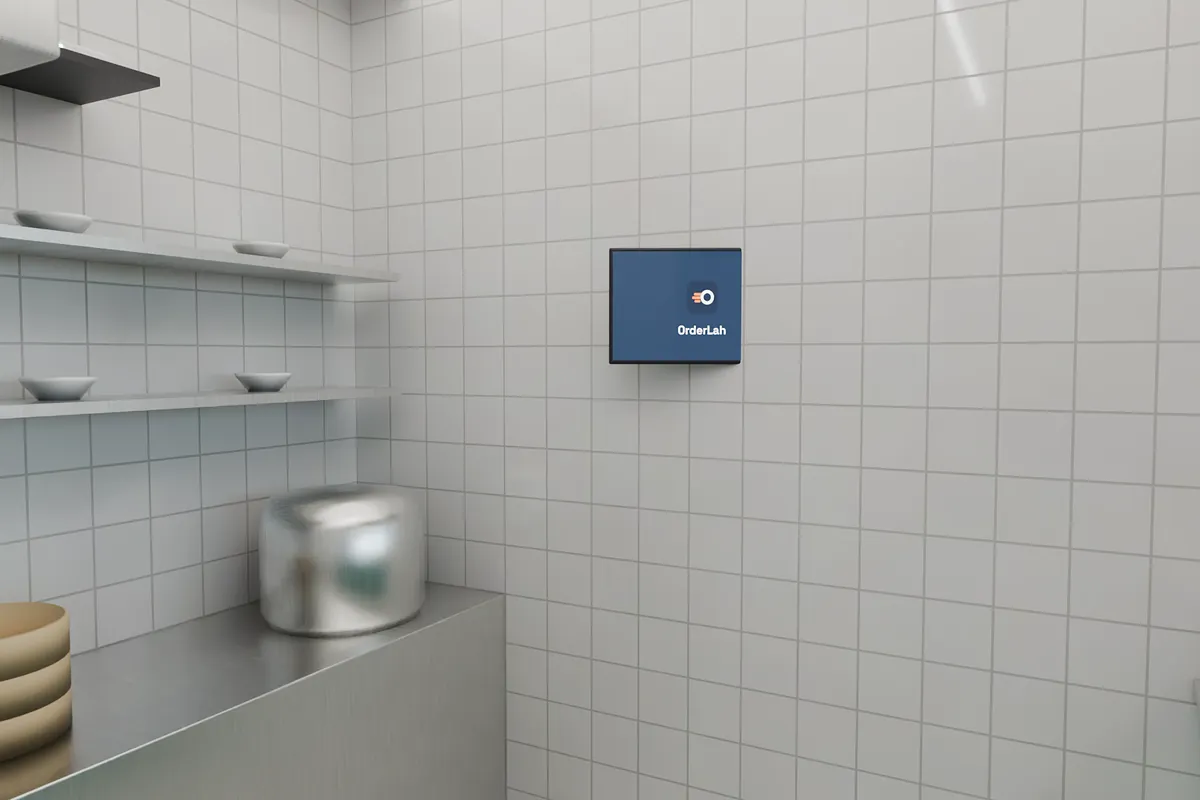 Inside the stall: steamers and a rice cooker on the back counter, shelves of bowls, and a screen on the side wall where the cook can read it, with the Wi-Fi router on a shelf above.